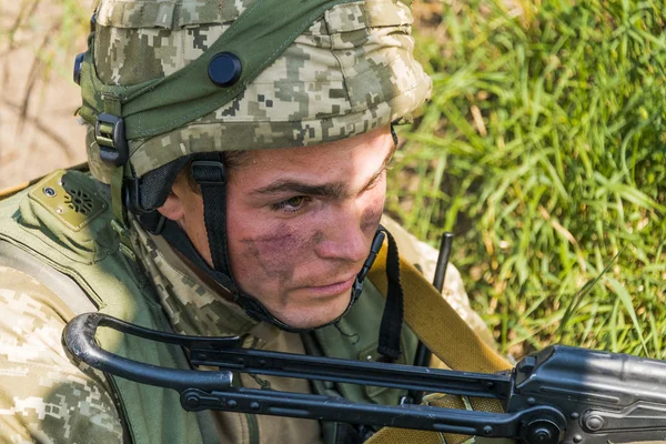 Commando ready to fire from the AK -74 at simulated enemy positi