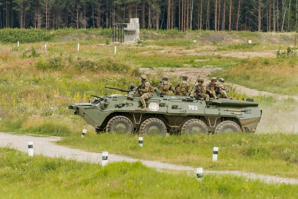 Marines move on an armored personnel carrier