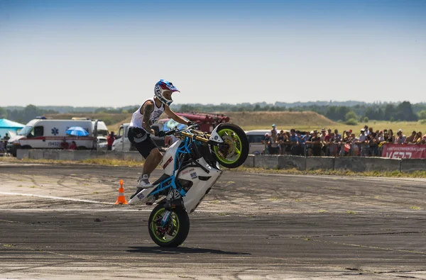 Unknown stunt bikers entertain the audience