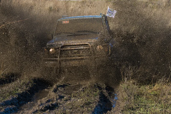 Unknown rider on the off-road vehicle overcomes a route