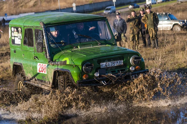 Off-road vehicle brand UAZ overcomes the track on a polygon
