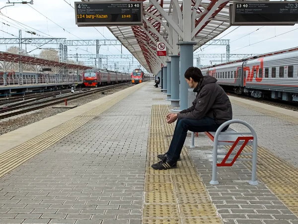 Photo of man waiting the train