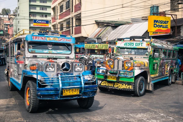 BAGUIO, PHILIPPINES - FEBRUARY 4, 2014: colorful jeepneys at the bus station of the city of Baguio. Inspired from US military jeeps, those are the cheapest and kitschest transportation in the country.