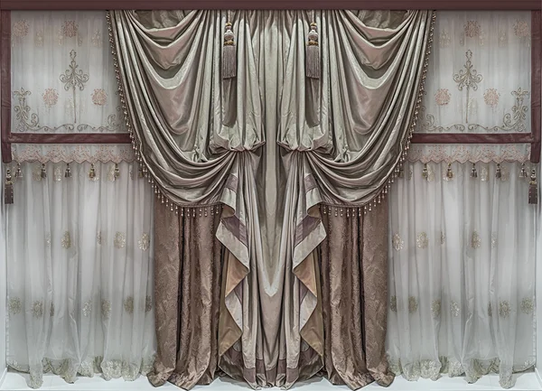 The elegant interior design. Bilateral luxury curtains and tulle.