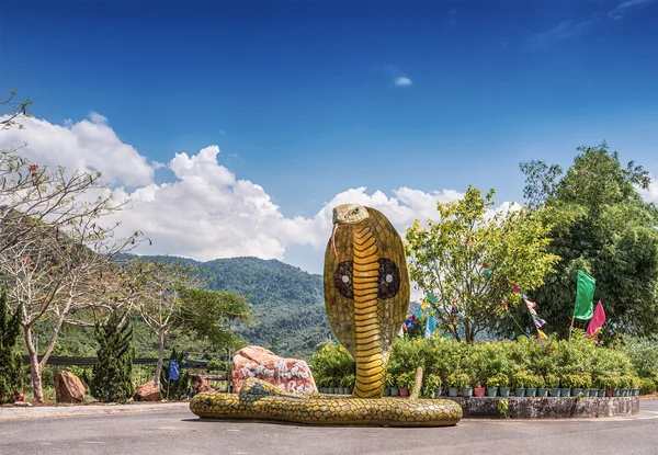 VIETNAM, YANG BAY RESERVE. MAY 6, 2015. The sculpture of the snake at the main entrance of the eco-park.