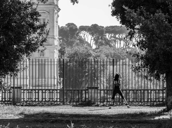 Young Roman Woman doing Stretching