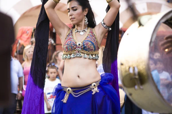 Trance. Belly dancer and arabic music street band