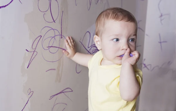 Baby boy thinking what to draw