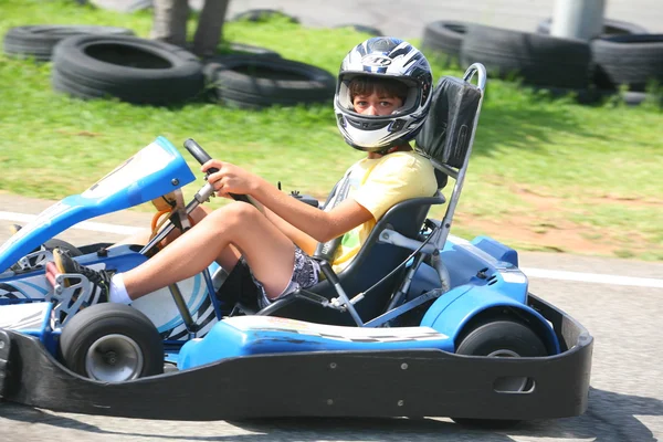 People having fun on a go cart. Summer season