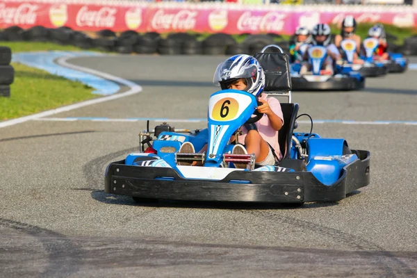 People having fun on a go cart. Summer season