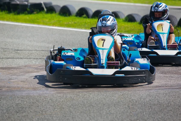 People having fun on a go cart. Summer season