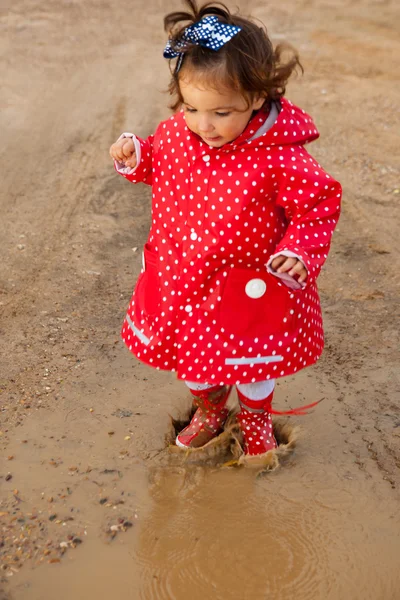 Jumping up and down on muddy puddles