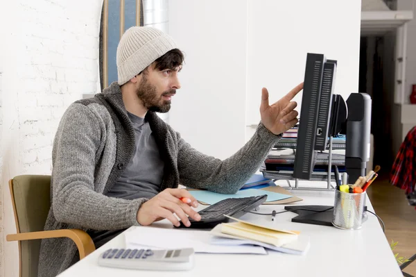 Attractive man hipste trendy businessman working desktop computer at home office