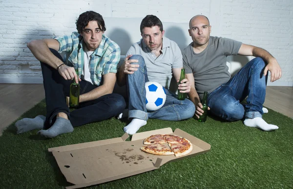 Friends fanatic football fans watching tv match with beer bottles and pizza suffering stress