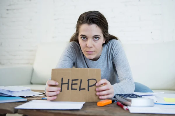 Young woman asking for help suffering stress doing domestic accounting paperwork bills