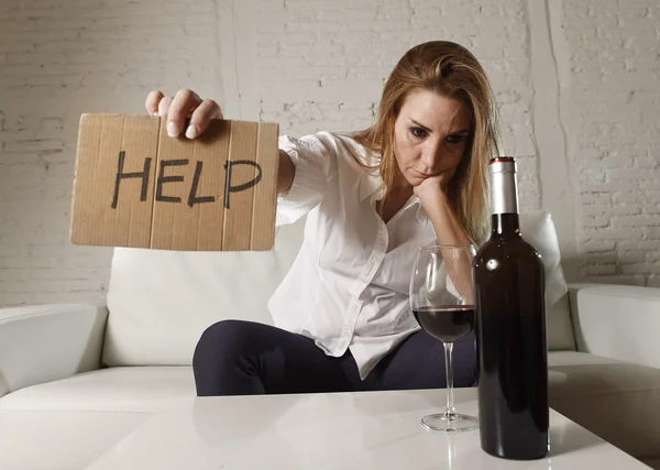 Drunk alcoholic blond woman drinking alcohol asking for help holding message board wasted