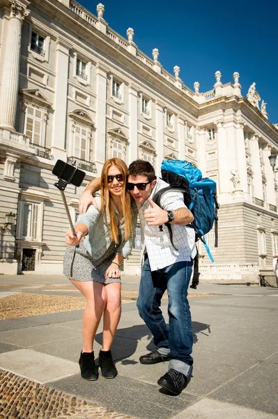 Beautiful friends tourist couple visiting Spain in holidays students exchange taking selfie picture