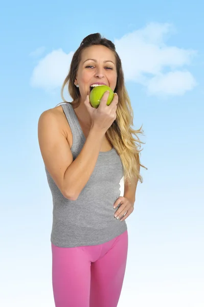 Sexy beautiful woman biting green apple fruit in  healthy eating