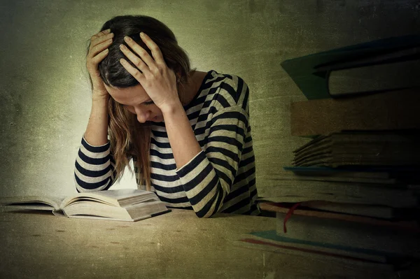 Young stressed student girl studying and preparing MBA test exam