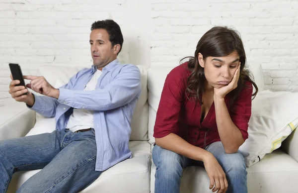 Social network addict man using mobile phone ignoring wife or girlfriend upset and angry