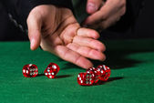 depositphotos_66916869-Male-hand-rolling-five-dice.jpg