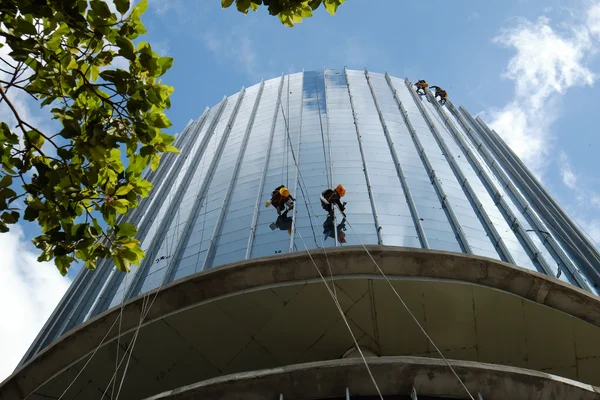 Asian worker climb on building, dangerous job