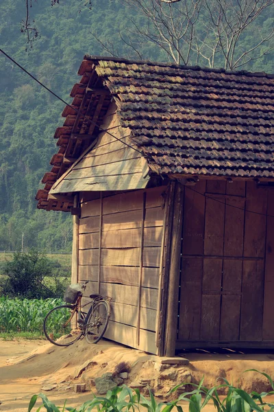 Old wooden house and bicycle at countryside