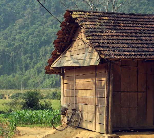 Old wooden house and bicycle at countryside