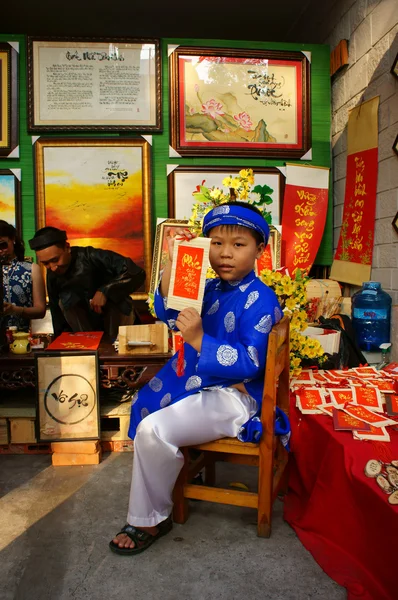 Vietnam tet, Asian kid, calligraphy fair