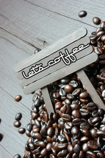 Coffee bean, wooden background, brown cafe bean