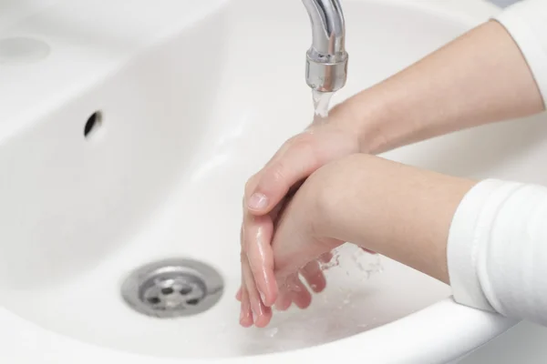 Children wash their hands