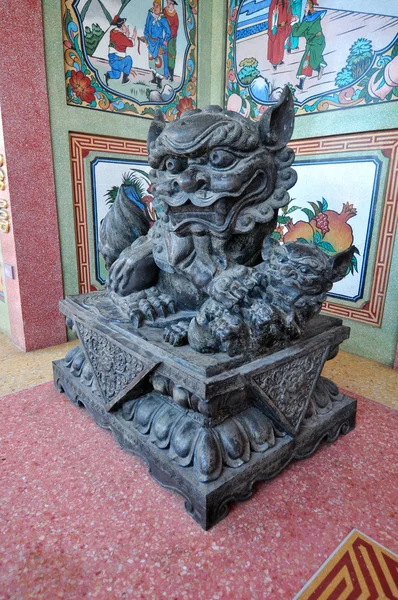 Female lion and cub statue in Chinese shrine,Chonburi,Thailand