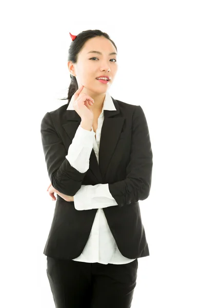 Devil side of a young Asian businesswoman standing with her finger on chin isolated on white background