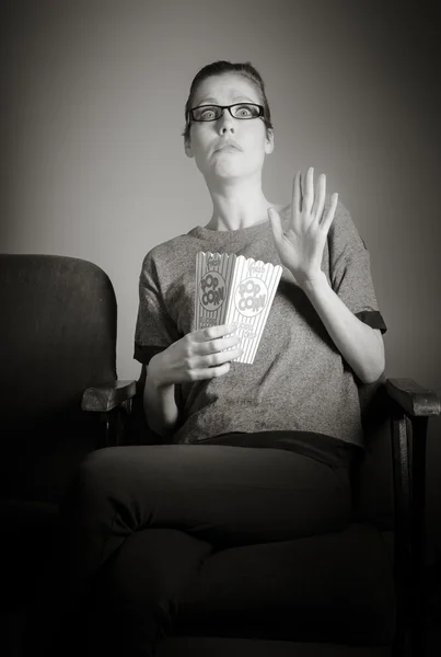 Woman watching movie at the cinema