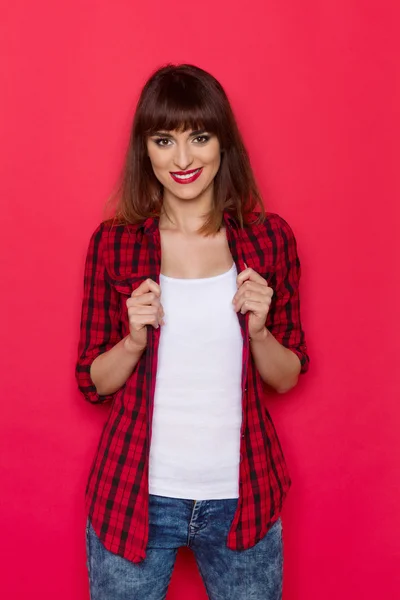 Confident Girl in Red Lumberjack Shirt