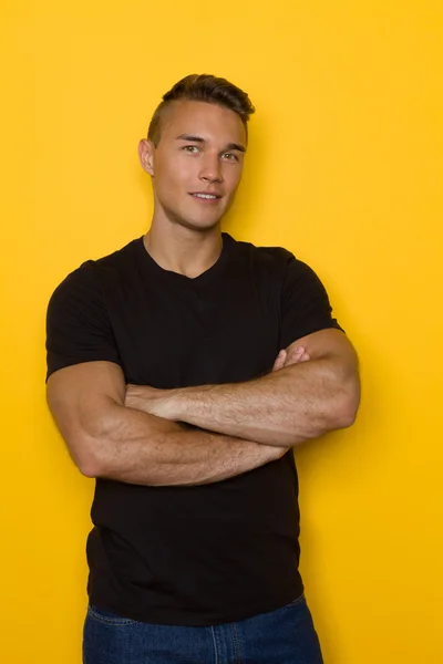 Handsome Man In Black T-shirt Posing With Arms Crossed
