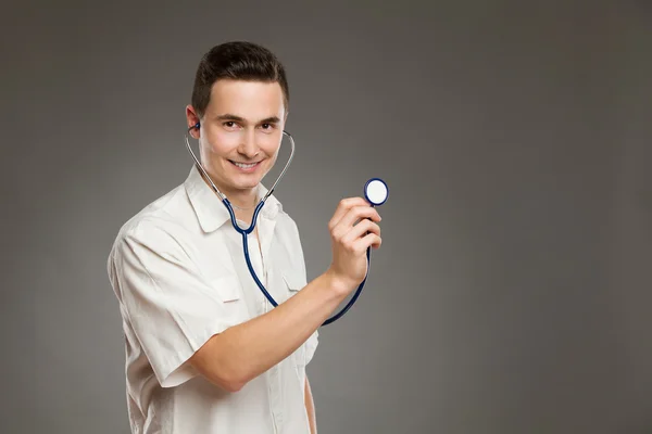 Cheerful doctor posing with stethoscope