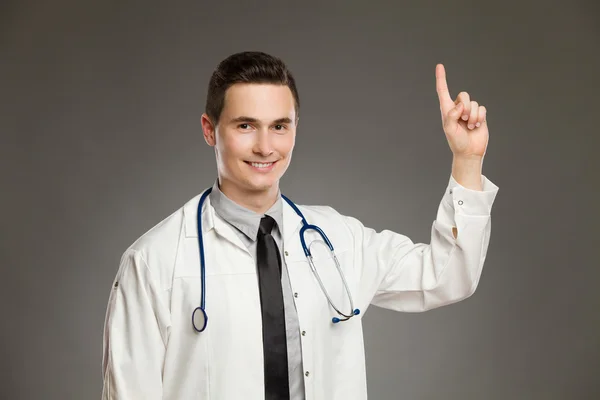 Male doctor pointing up