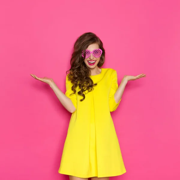 Girl In Pink Sunglasses With Hand Raised