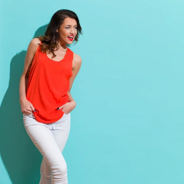 Shouting Woman In Red Shirt On Turquoise Background