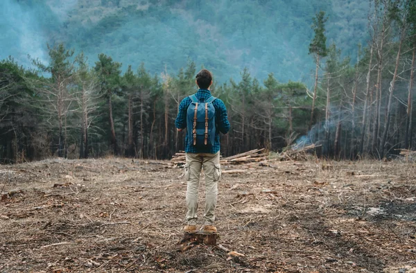 Hiker man standing in forest