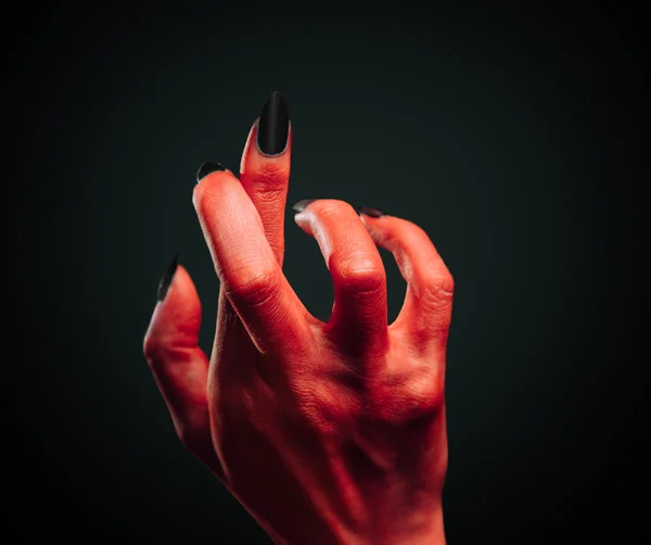 Demon hand with gesture cross fingers