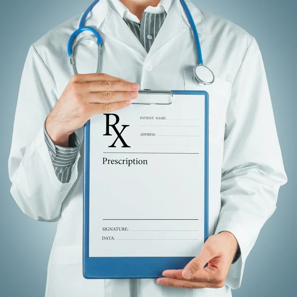 Doctor gives prescription paper