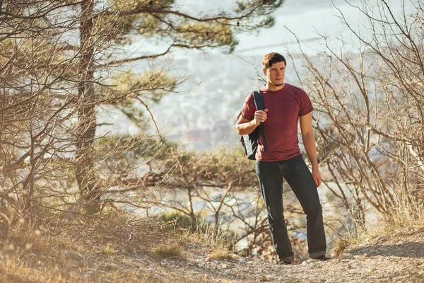 Hiker man walking in forest