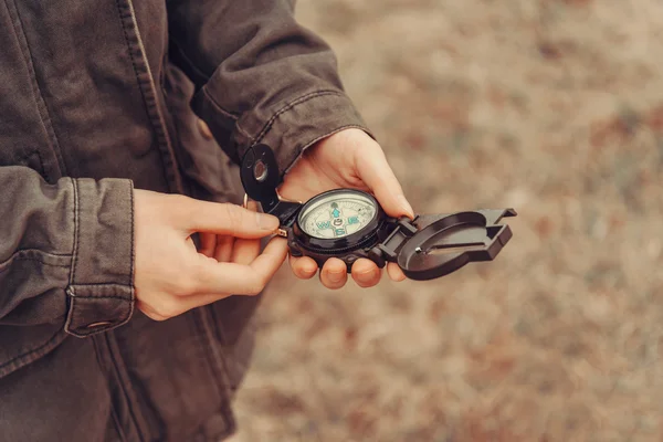 Hiker woman with compass outdoor
