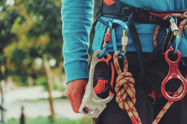 Rock climber wearing safety harness