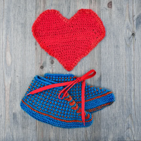Crochet booties and heart.