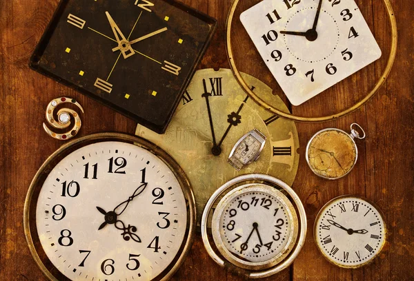 Old clocks on a grungy background
