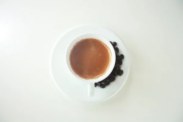 Top view white cup of coffee isolated on a white background