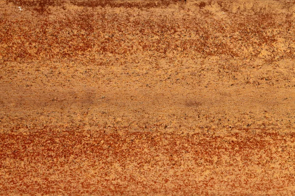 Red and brown rust on metal